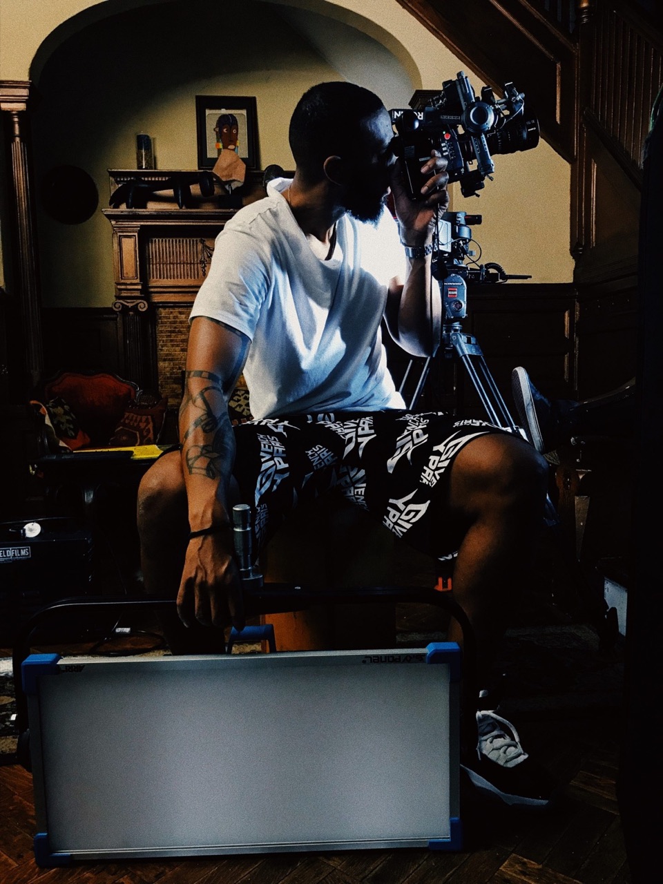 Operator behind a cinema camera in the Kleenhouse parlor