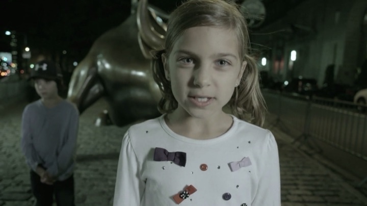 Girl bull statue night
