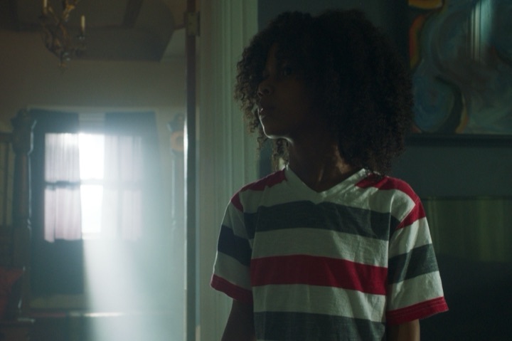 Kid striped shirt doorway